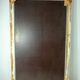 Large antique beveled mirror in carved wood painted with floral decoration and
