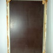 Large antique beveled mirror in carved wood painted with floral decoration and