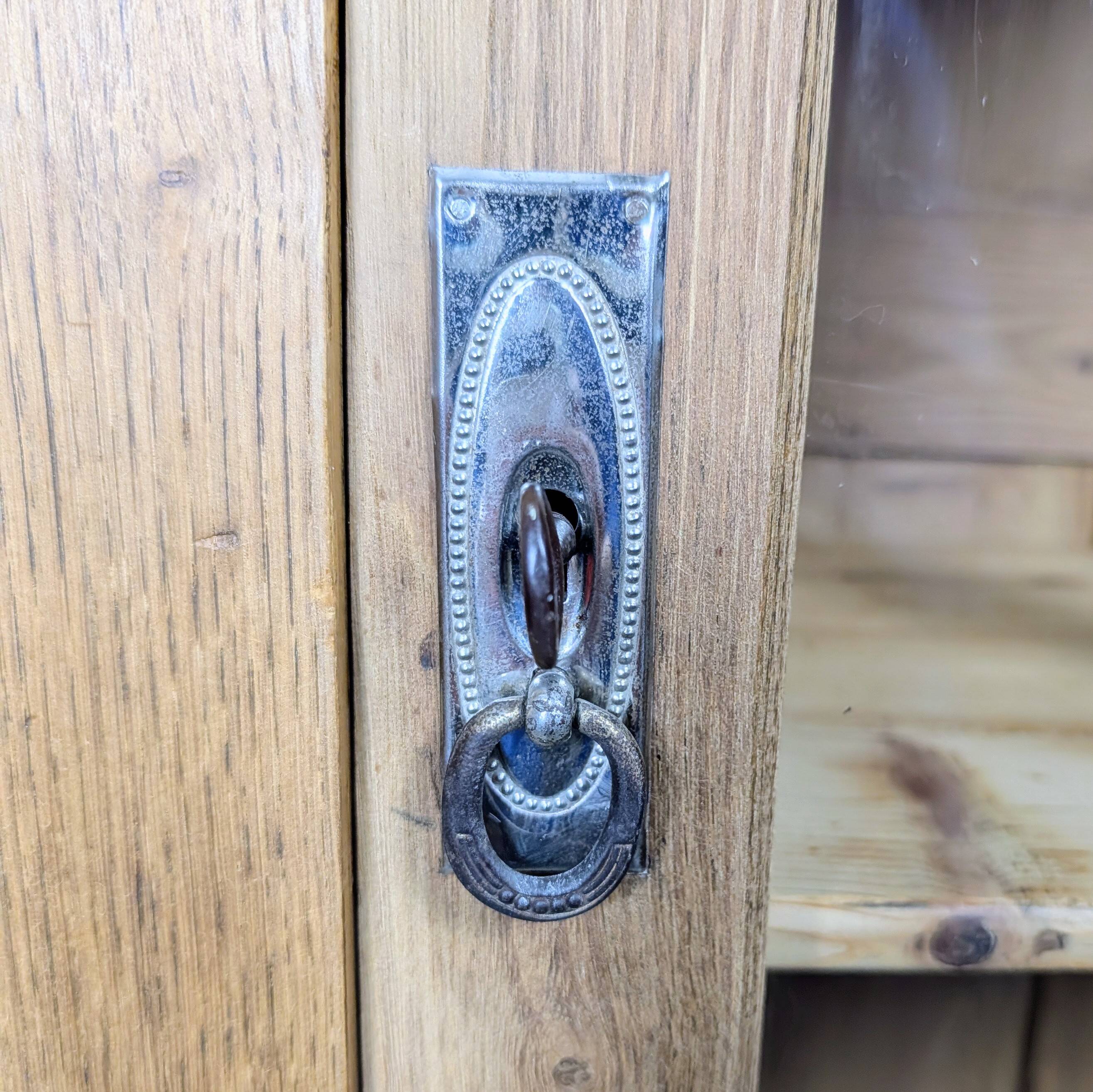 Glass-fronted cabinet from the 1930s-1940s.
