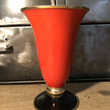 Cut vase on foot in red and black metal