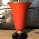 Cut vase on foot in red and black metal