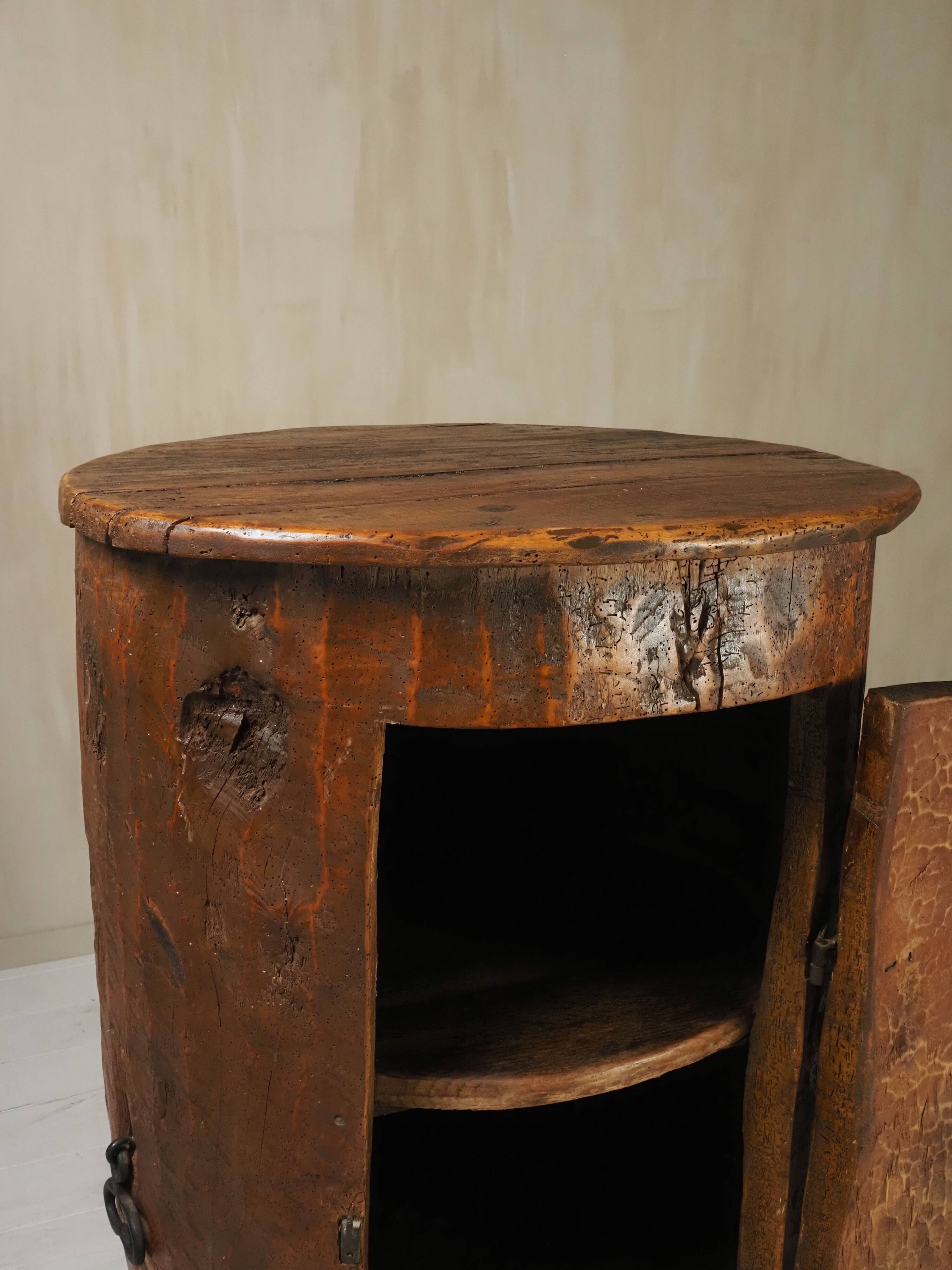 Primitive folk art cabinet made of an old tree trunk.
