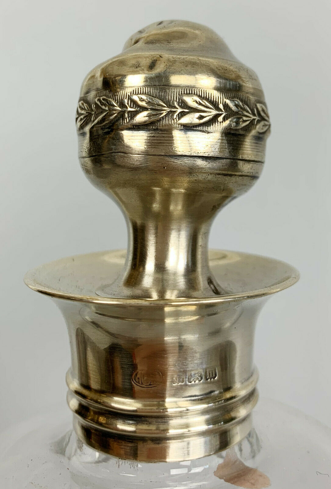 Blown glass carafe with silver frame and cap