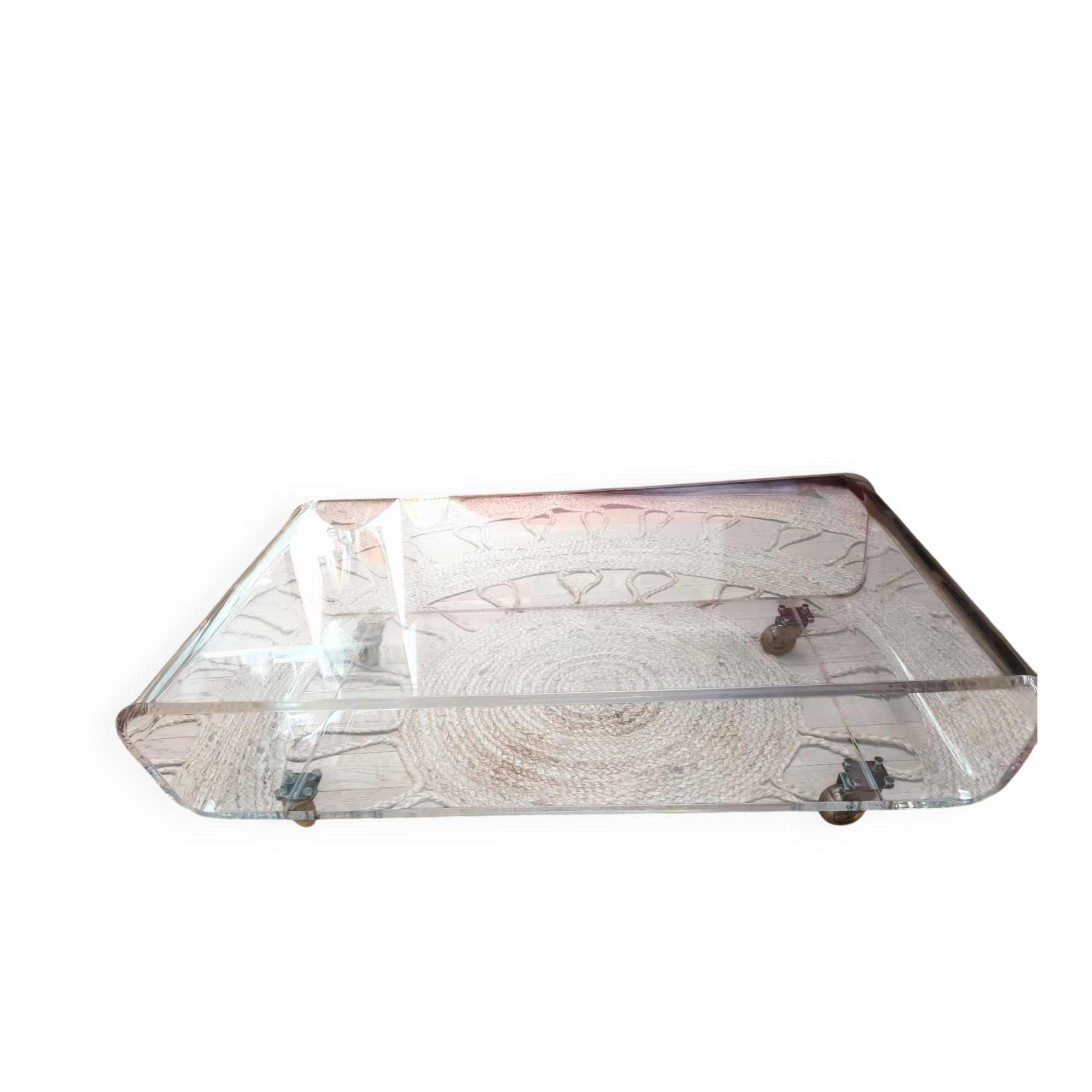 Design coffee table from Habitat in transparent plexiglass, mounted on wheels.