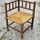 Turned wood straw corner armchair