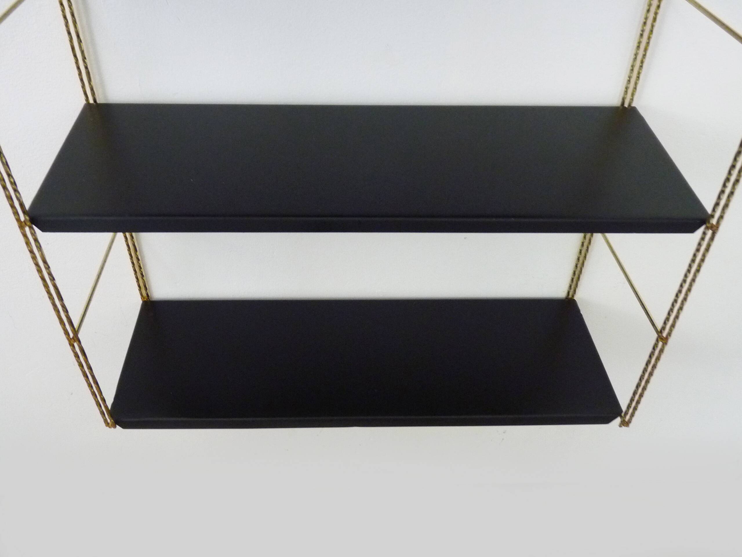 Vintage black and gold String design shelf. 60s