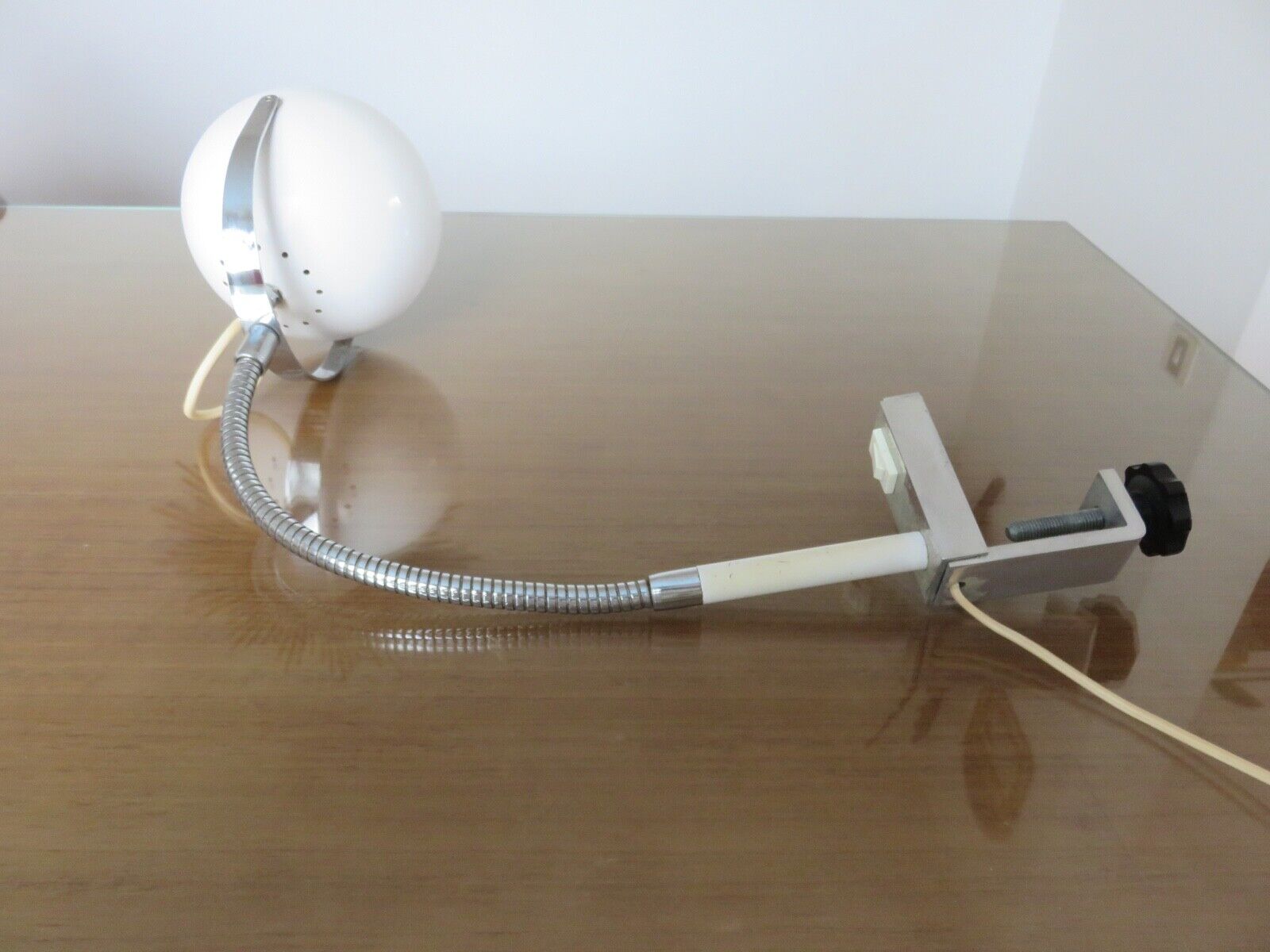 Eye ball lamp stapled on a chrome hose 70s