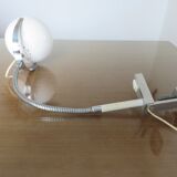 Eye ball lamp stapled on a chrome hose 70s