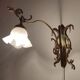 Bronze Modernist wall lamp. Spain, 1930s.