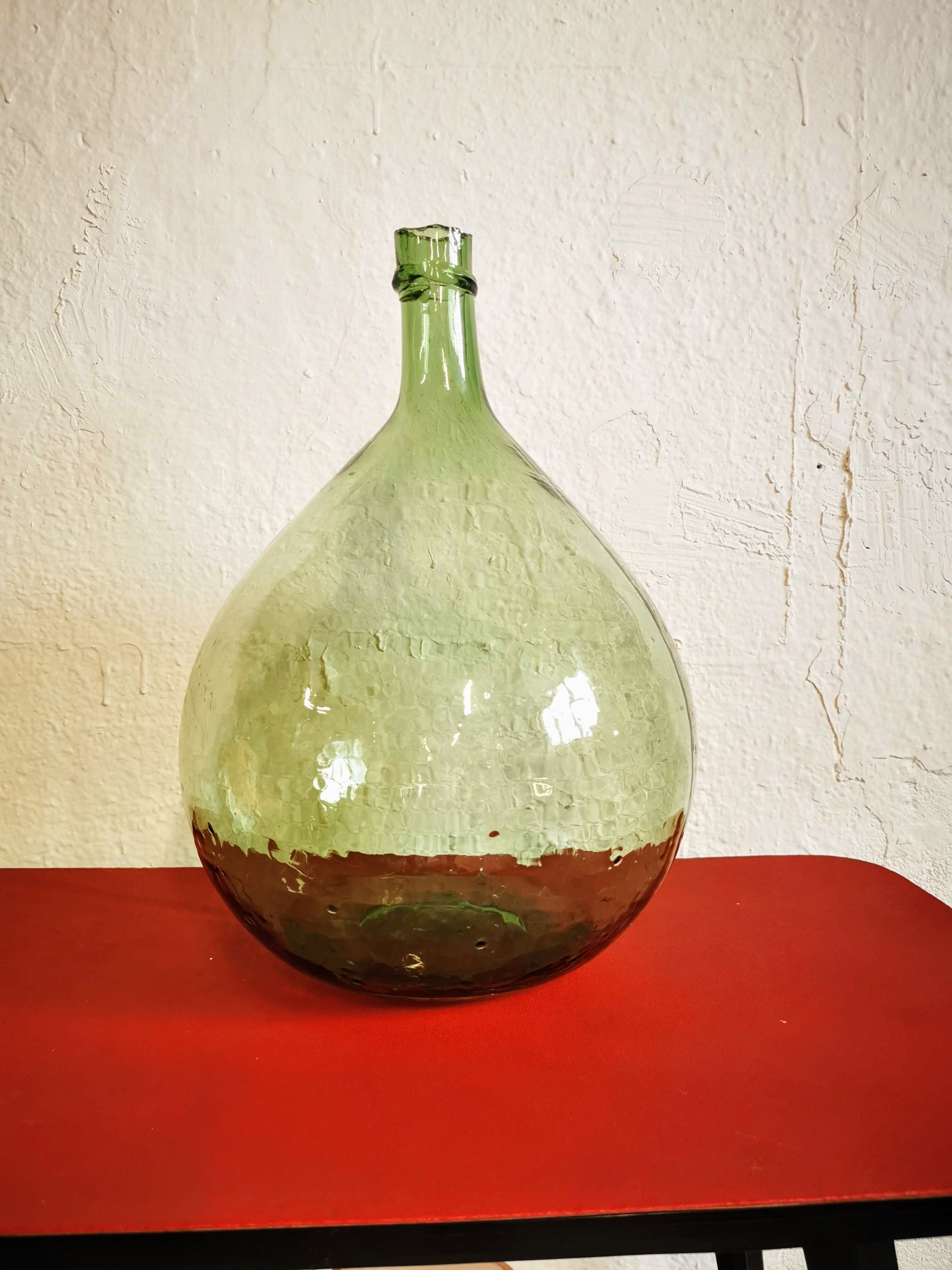 Green demijohn contains 12 liters