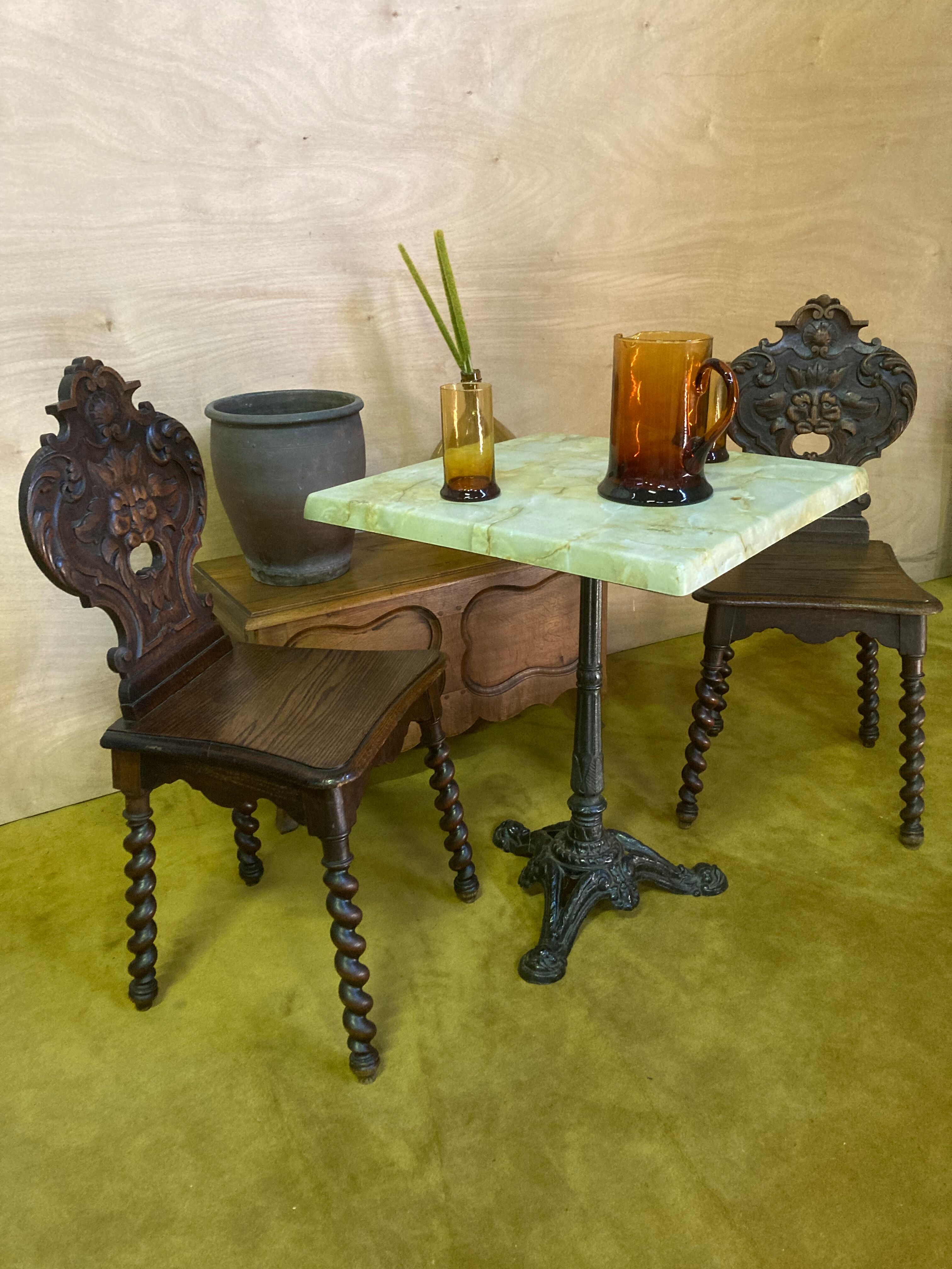 Duo of carved wooden chairs