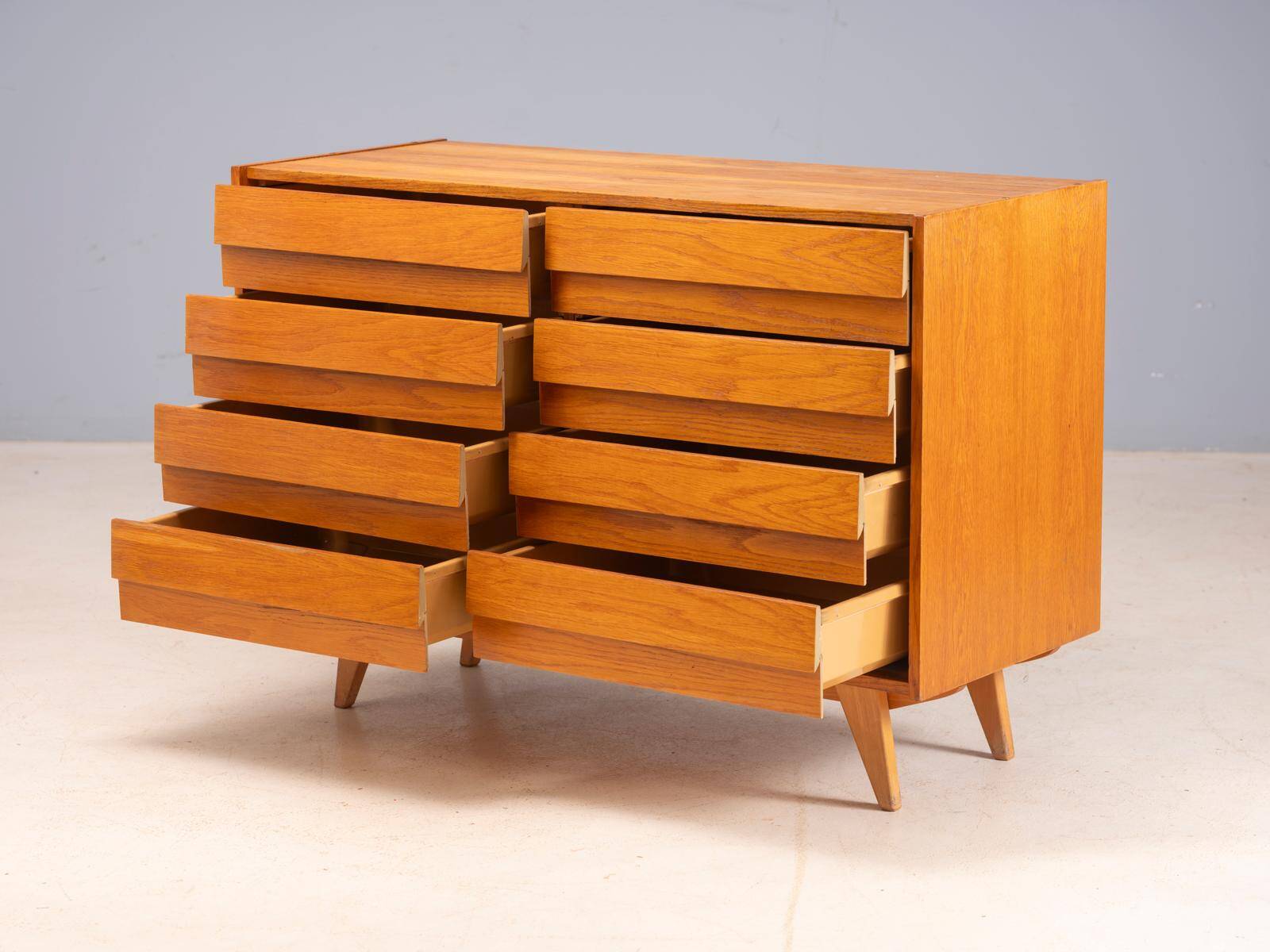 Vintage Czech chest of drawers U-453 by Jiří Jiroutek, 1960s, oak veneer, 110 × 45 × 77 cm