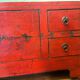 Antique Chinese red lacquered low cabinet