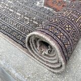 Vintage hand knotted rug with geometric patterns on a grey/beige/terracotta background 170 x 96 cm