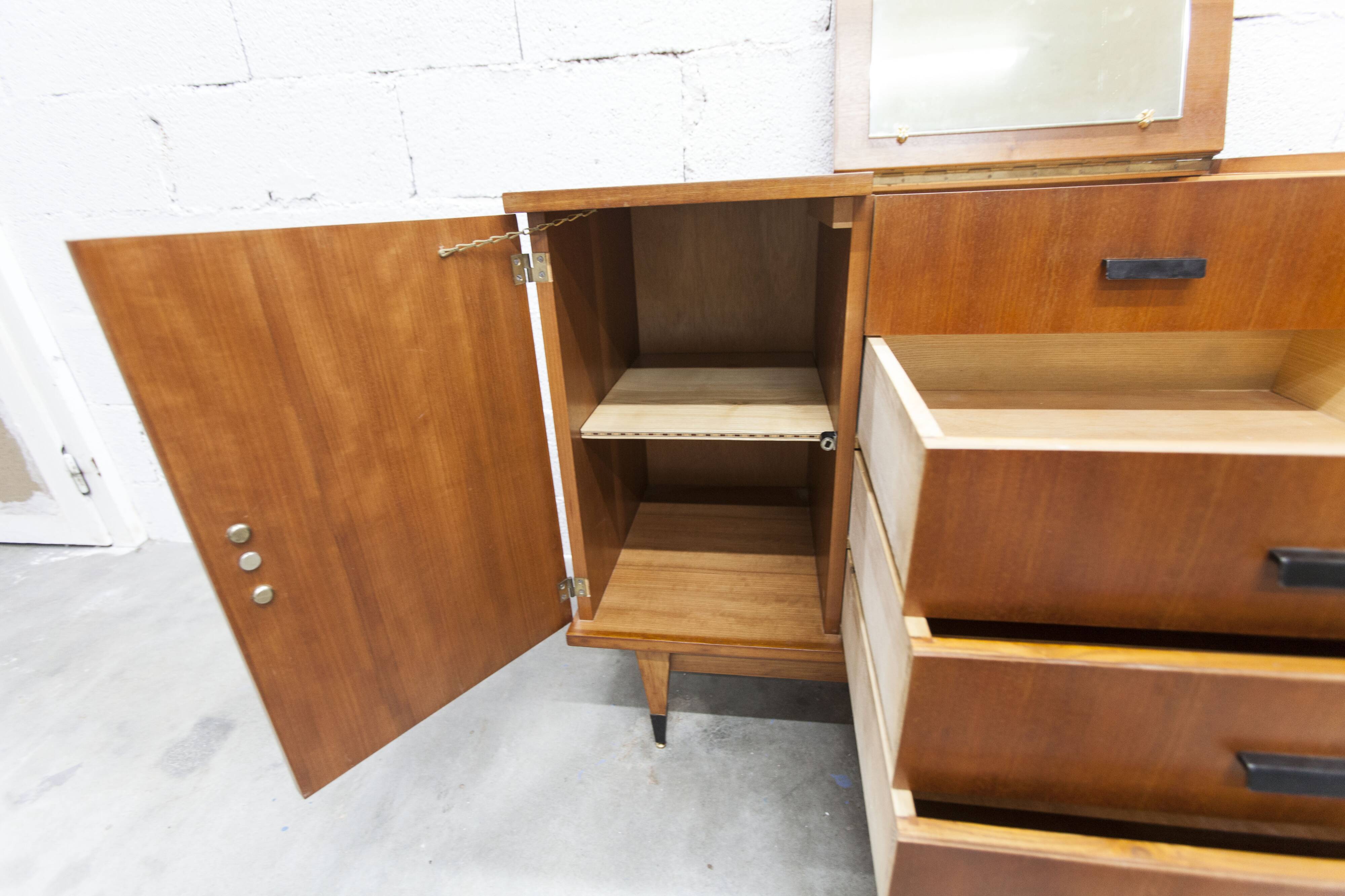 1960s teak sideboard with 4 drawers, 2 doors, and a mirror.
