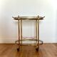 Vintage serving trolley in gilded brass and glass