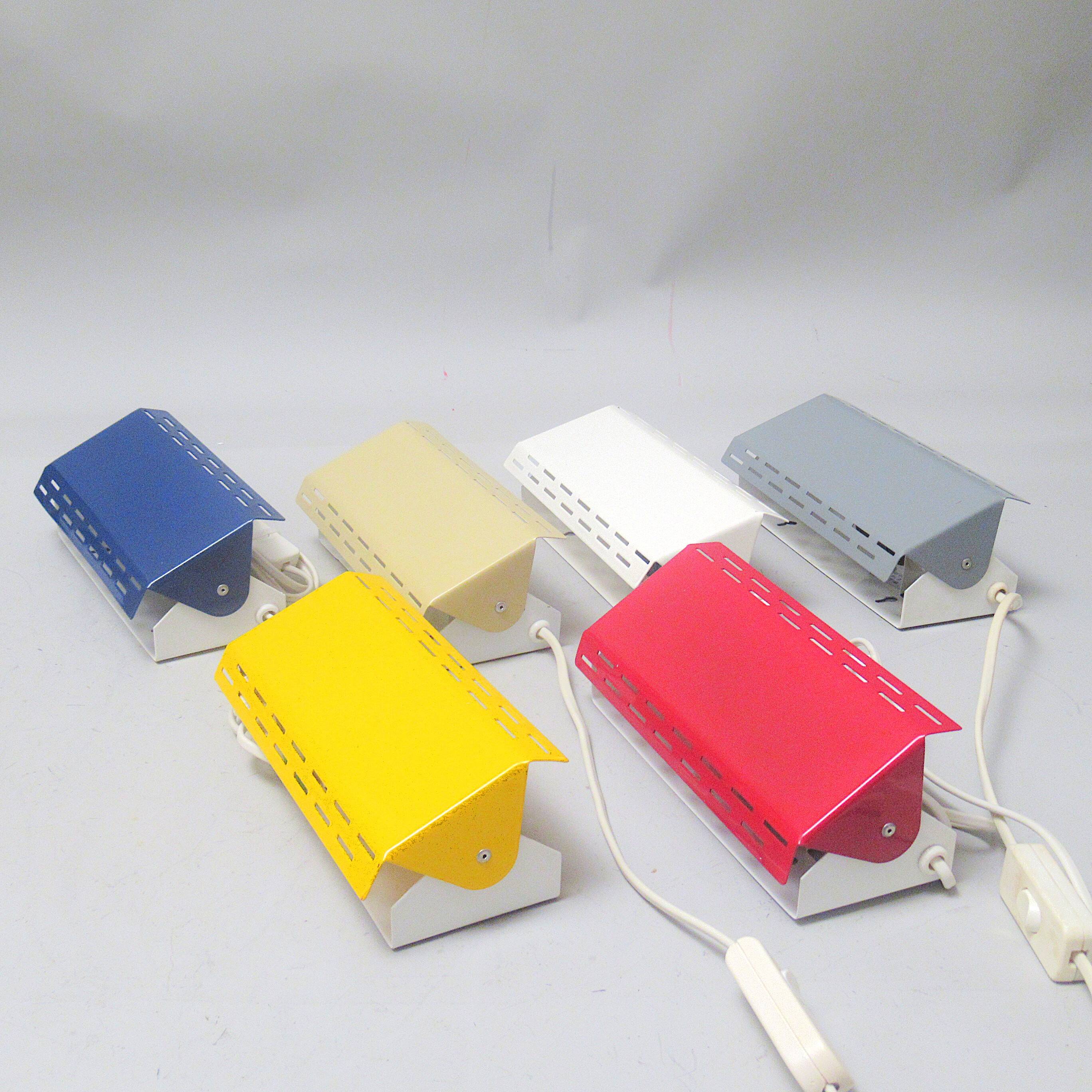 Modernist wall light with a yellow pivoting shade from the 1980s.