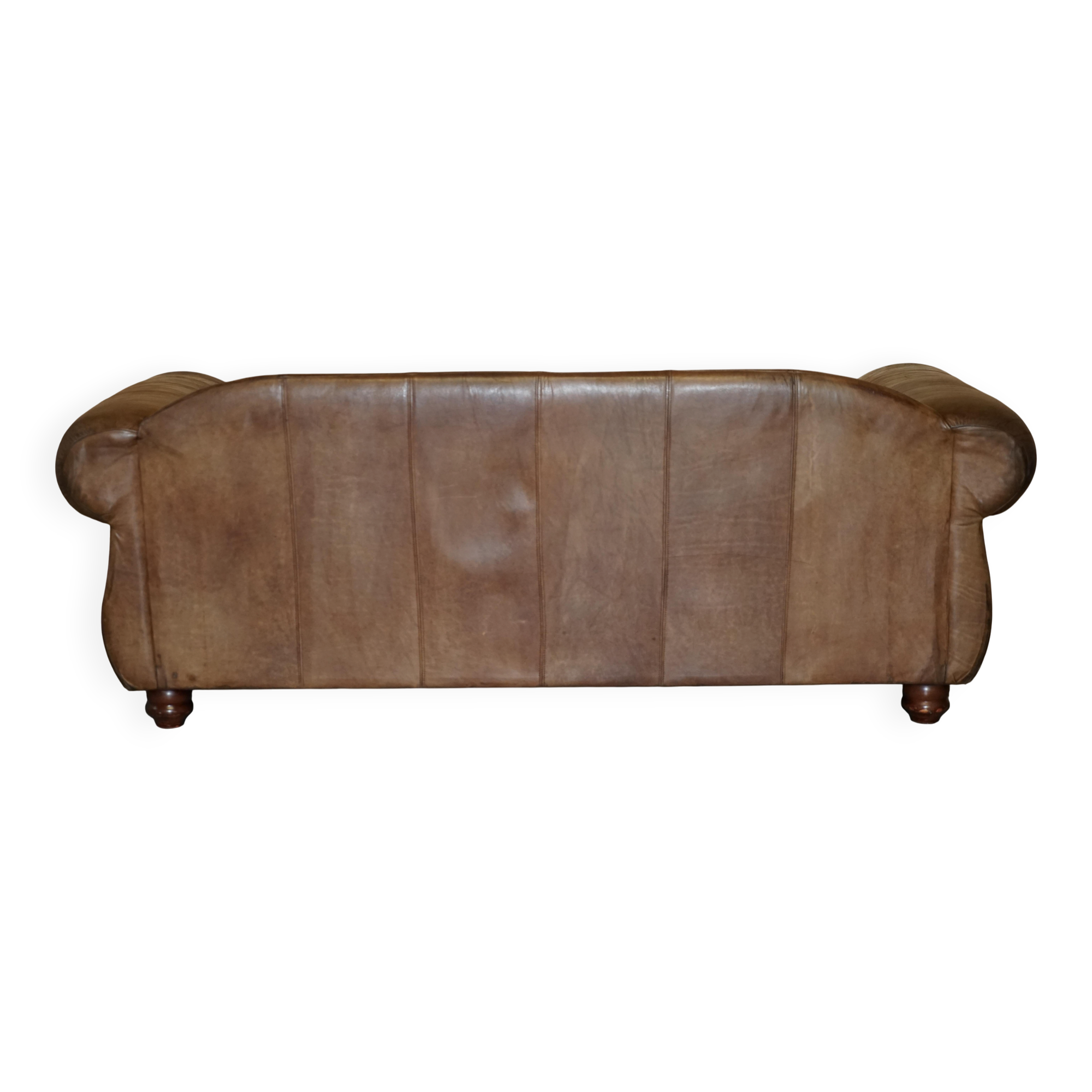 Vintage leather sofas by Thomas Lloyd with Kilim cushions.