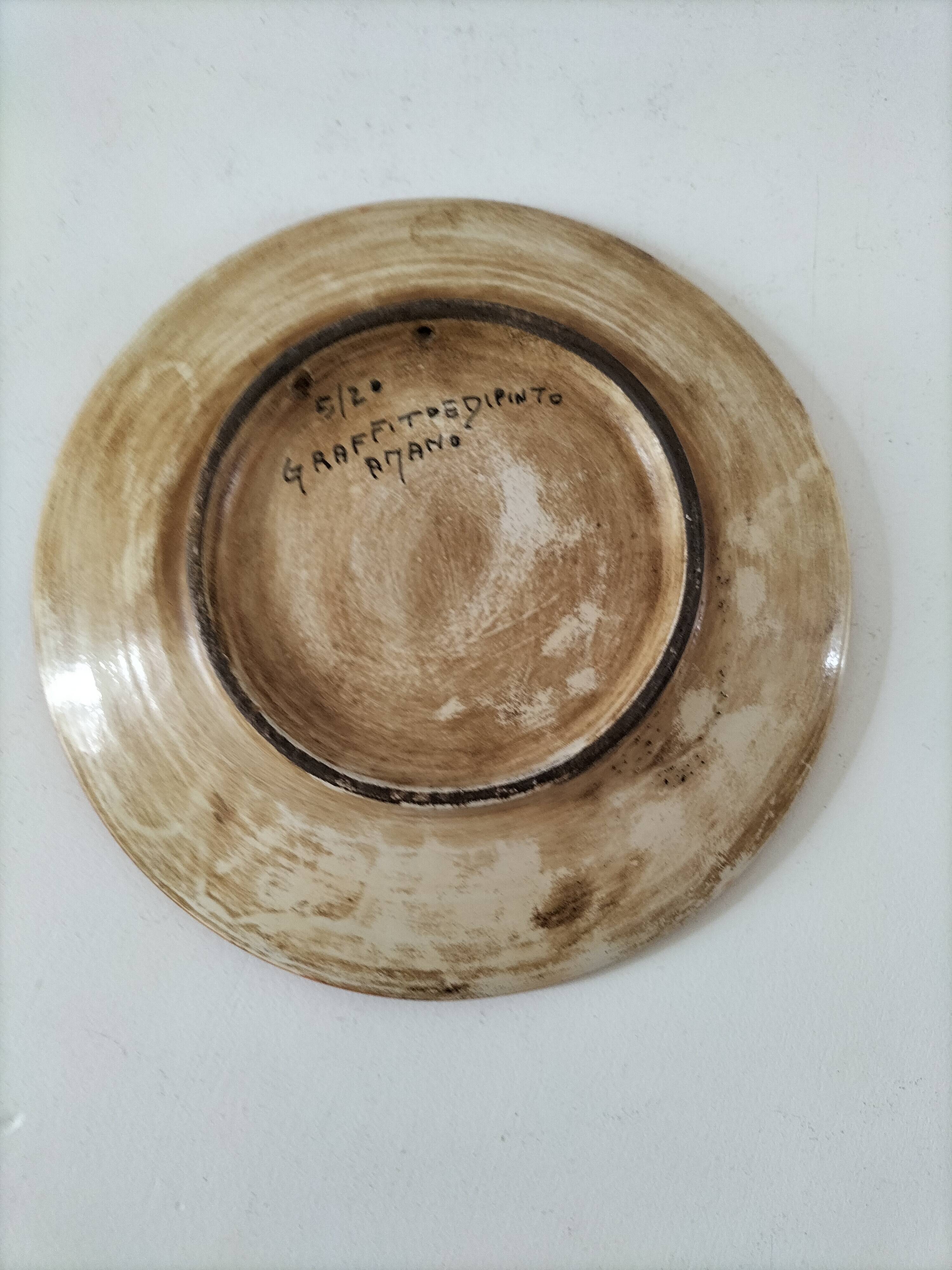 Spanish earthenware plate, hand-painted floral decoration.