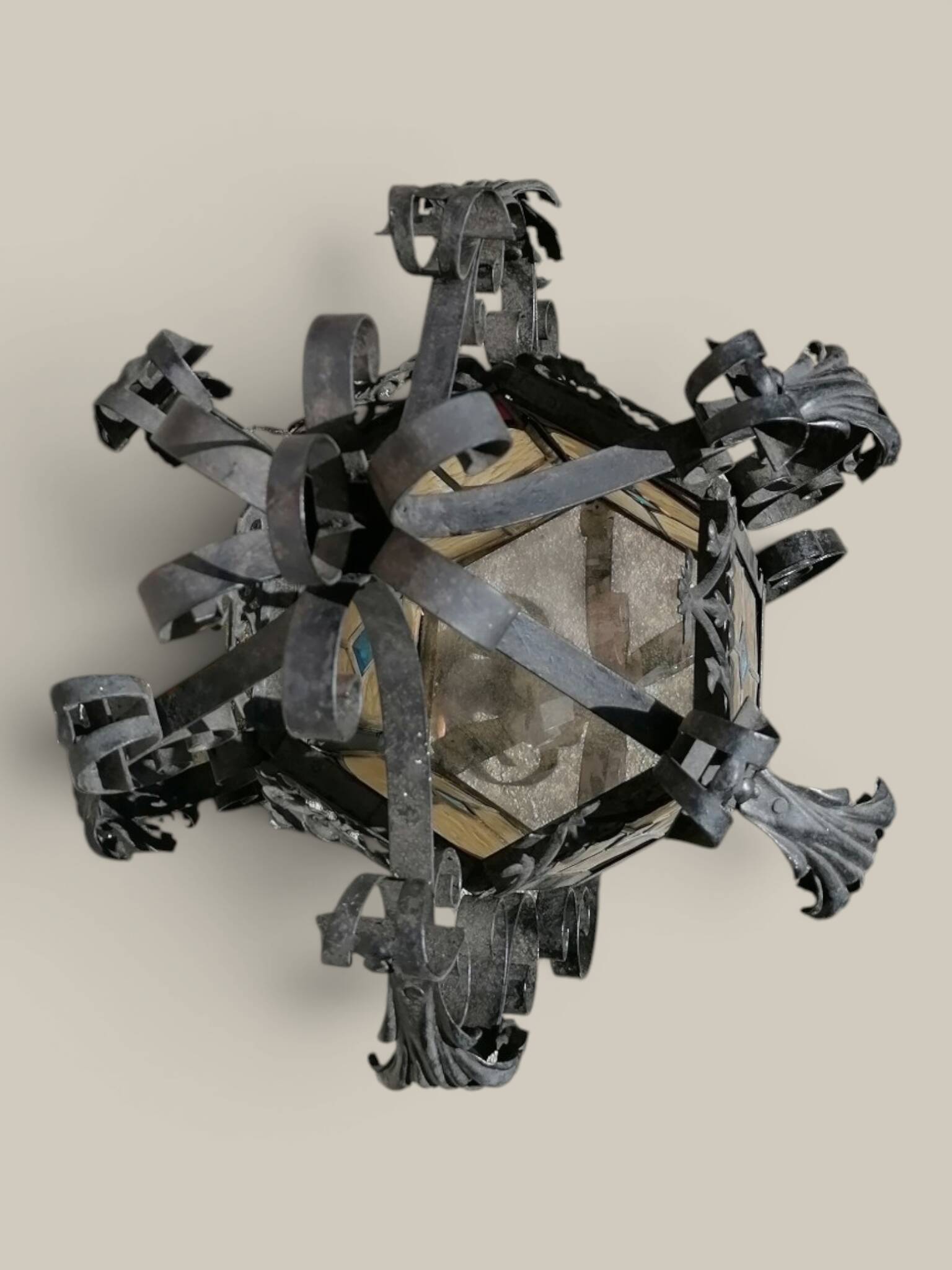 Black wrought iron lantern with stained glass. Medieval, Gothic decoration.