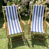 Pair of wooden deck chairs with armrests in blue bayadere fabric