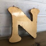 Golden sign letter "N"