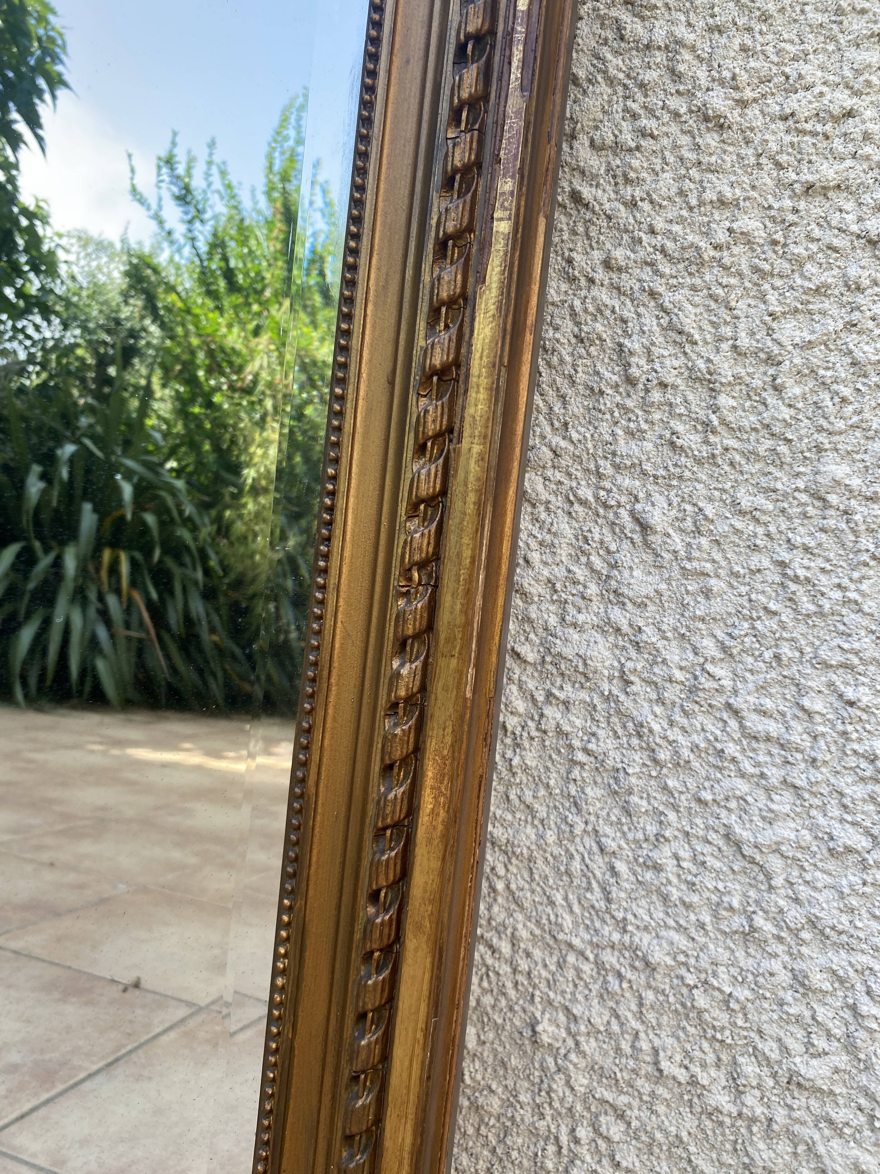 19th century Louis XVI style mirror in wood gilded with gold leaf, 74x150cm