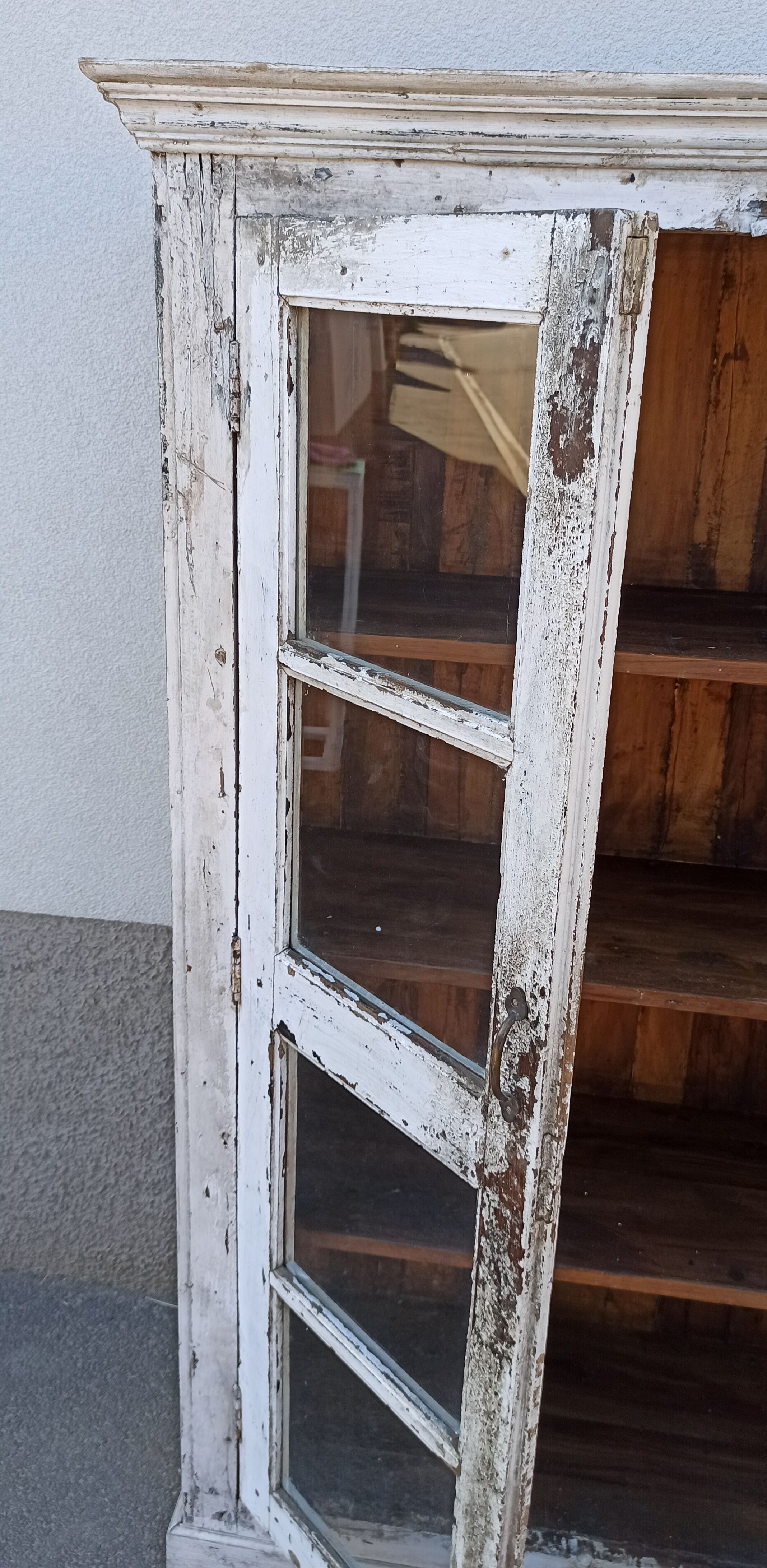 White wooden antique glazed wardrobe