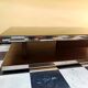 Designer coffee table in glass and chrome metal.