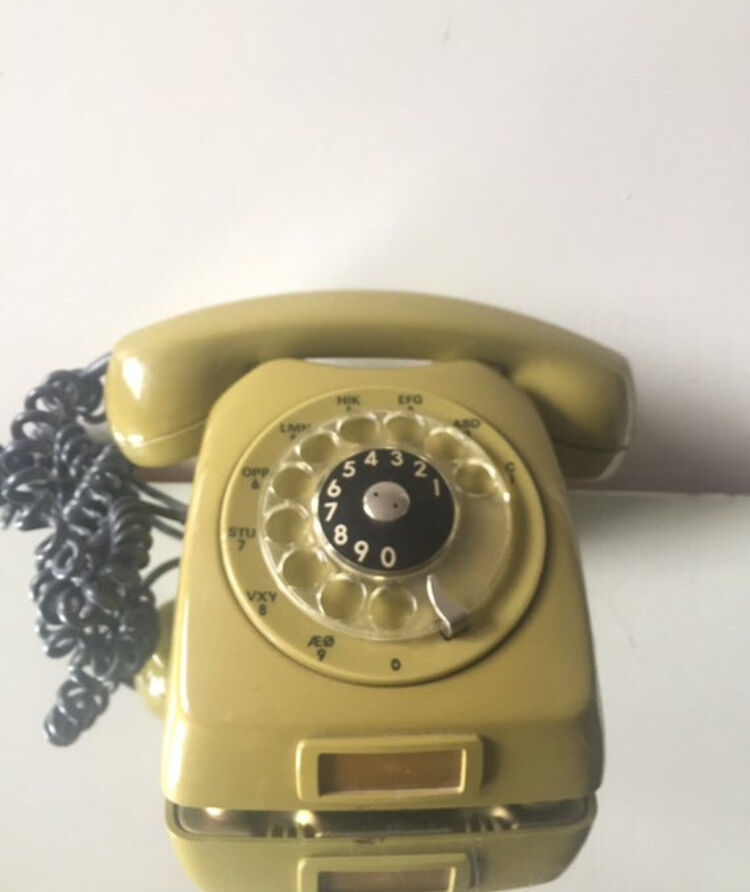 Vintage mustard green rotary telephone