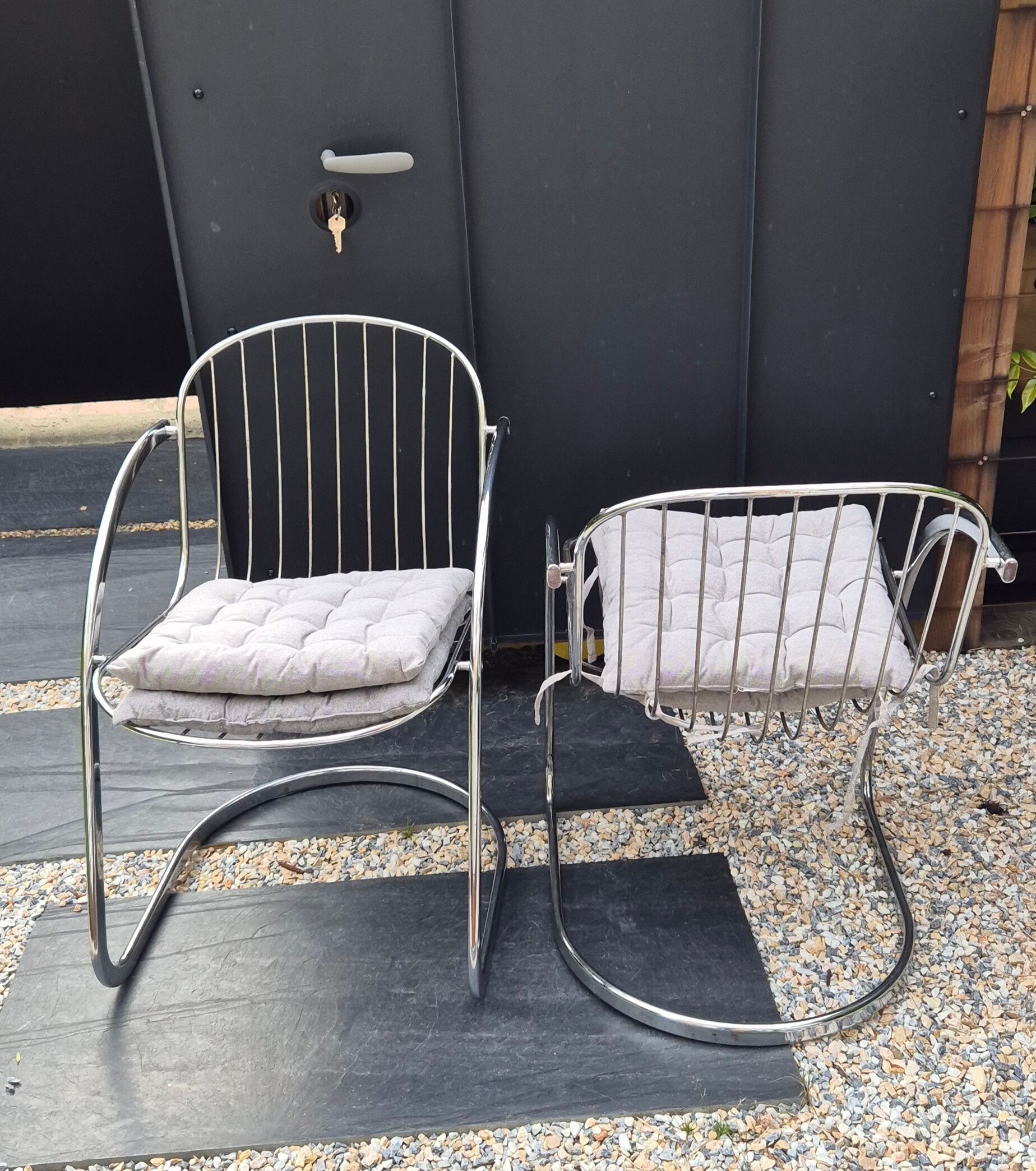 A pair of space age wire chairs