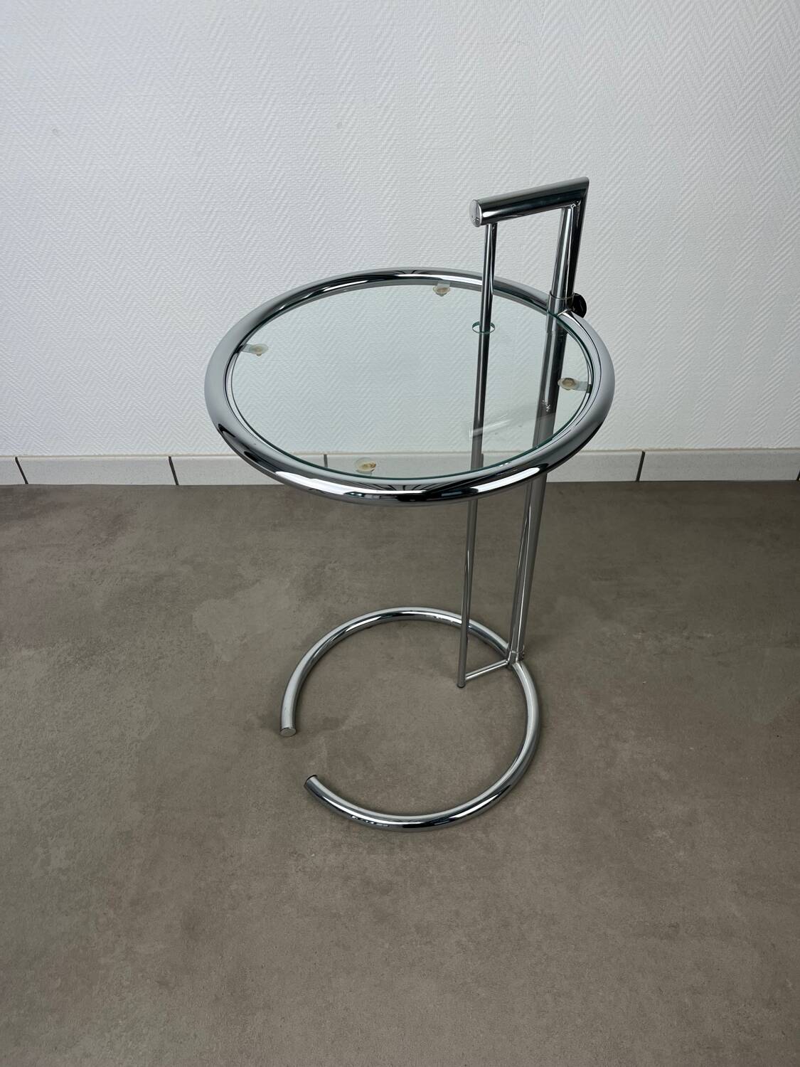Chrome and glass design side table, adjustable.