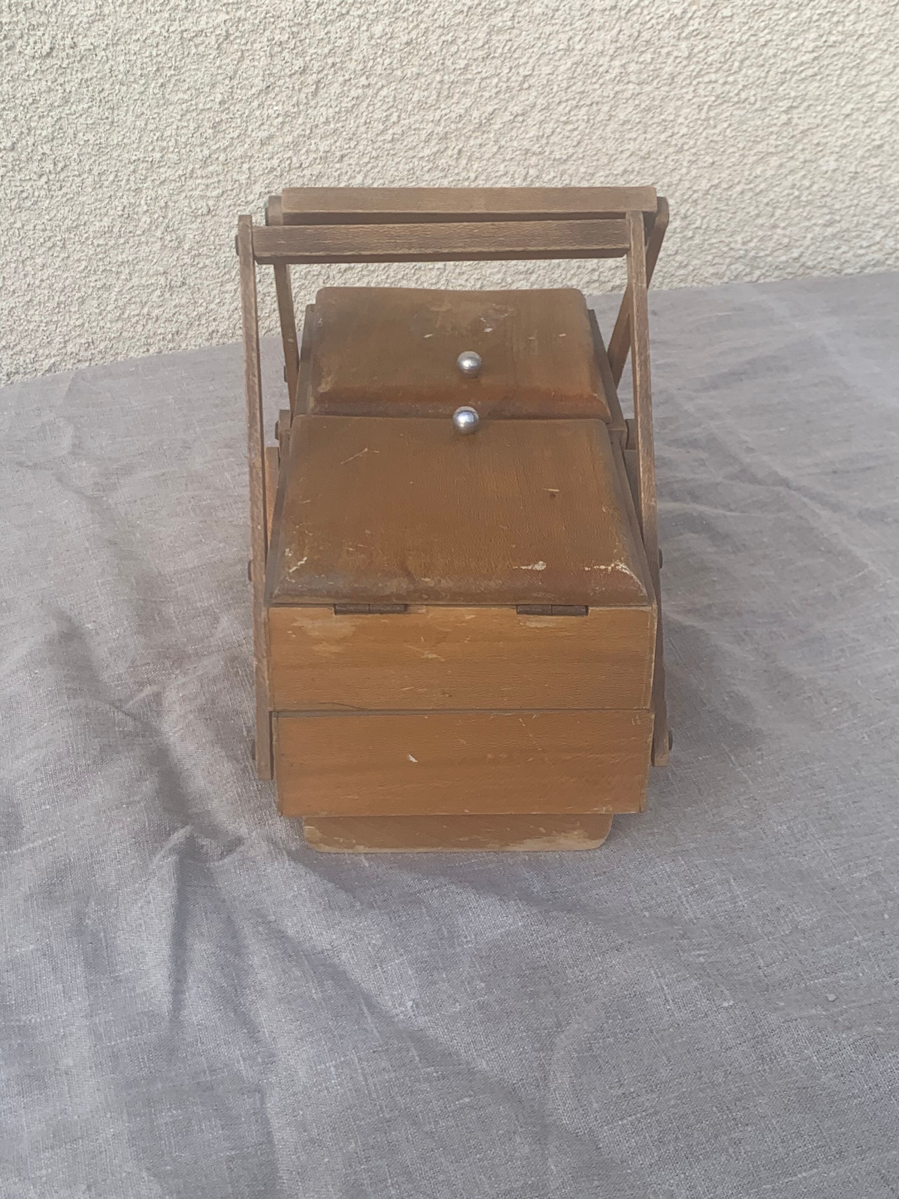 Sewing box in old varnished wood