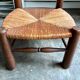 Low brutalist chair in dark wood and straw no. 2