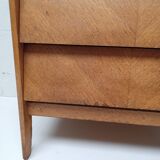 High wooden chest of drawers in the 50s