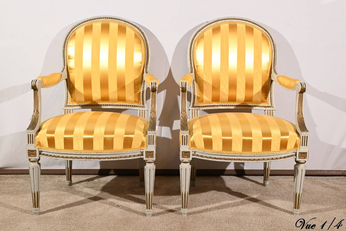 Pair of Cabriolet Armchairs, in rechampi wood, Louis XVI style – Late 19th century