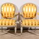 Pair of Cabriolet Armchairs, in rechampi wood, Louis XVI style – Late 19th century