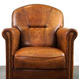 Charming and rugged sheepskin leather armchair, large model