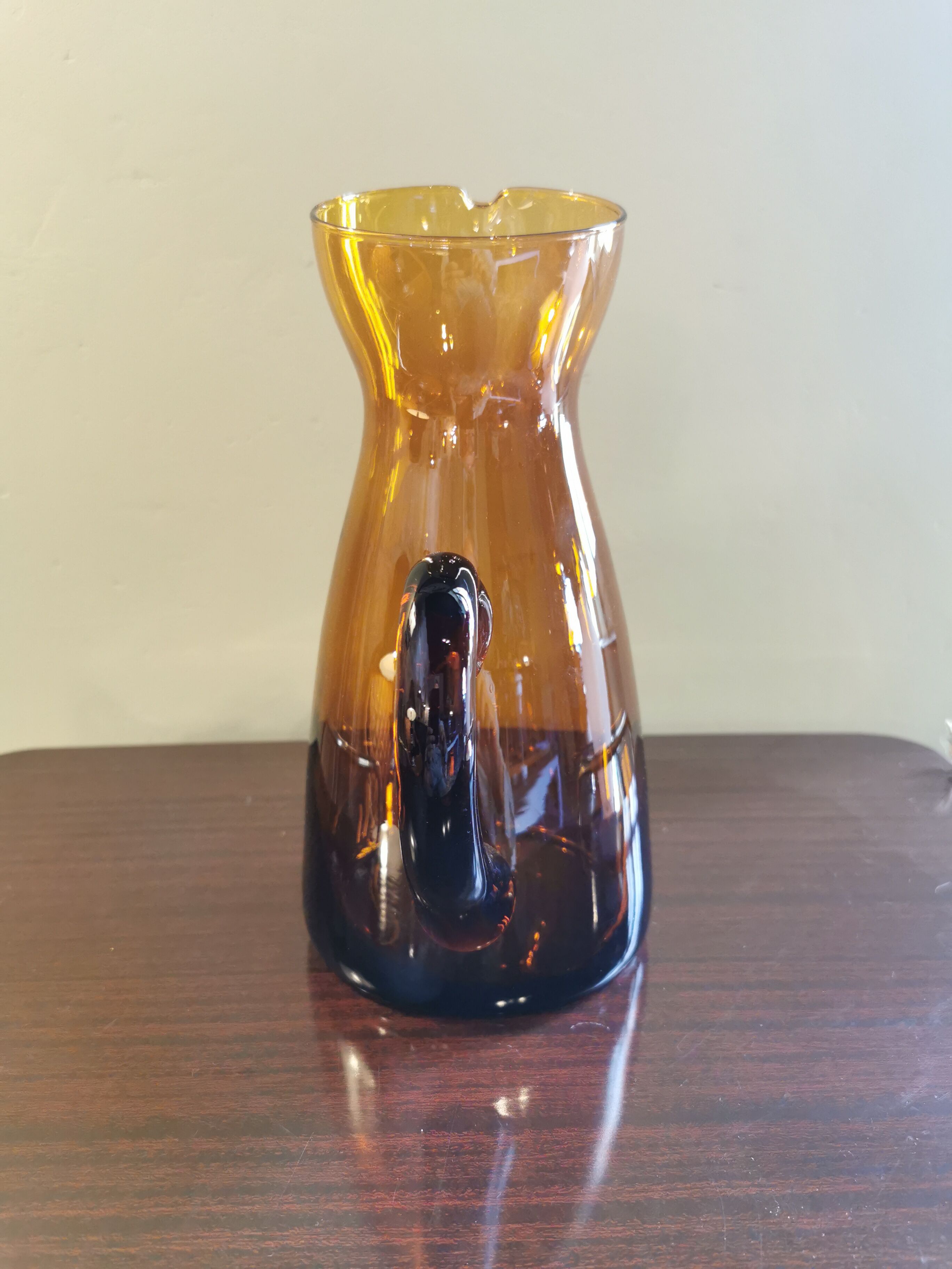 Vintage pitcher in amber glass