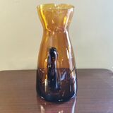 Vintage pitcher in amber glass