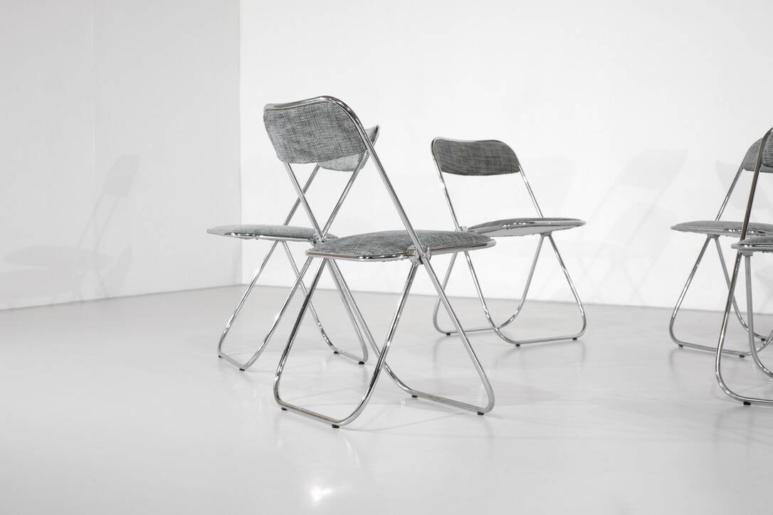 Set of 9 chrome folding chairs with fabric from the 1970s.