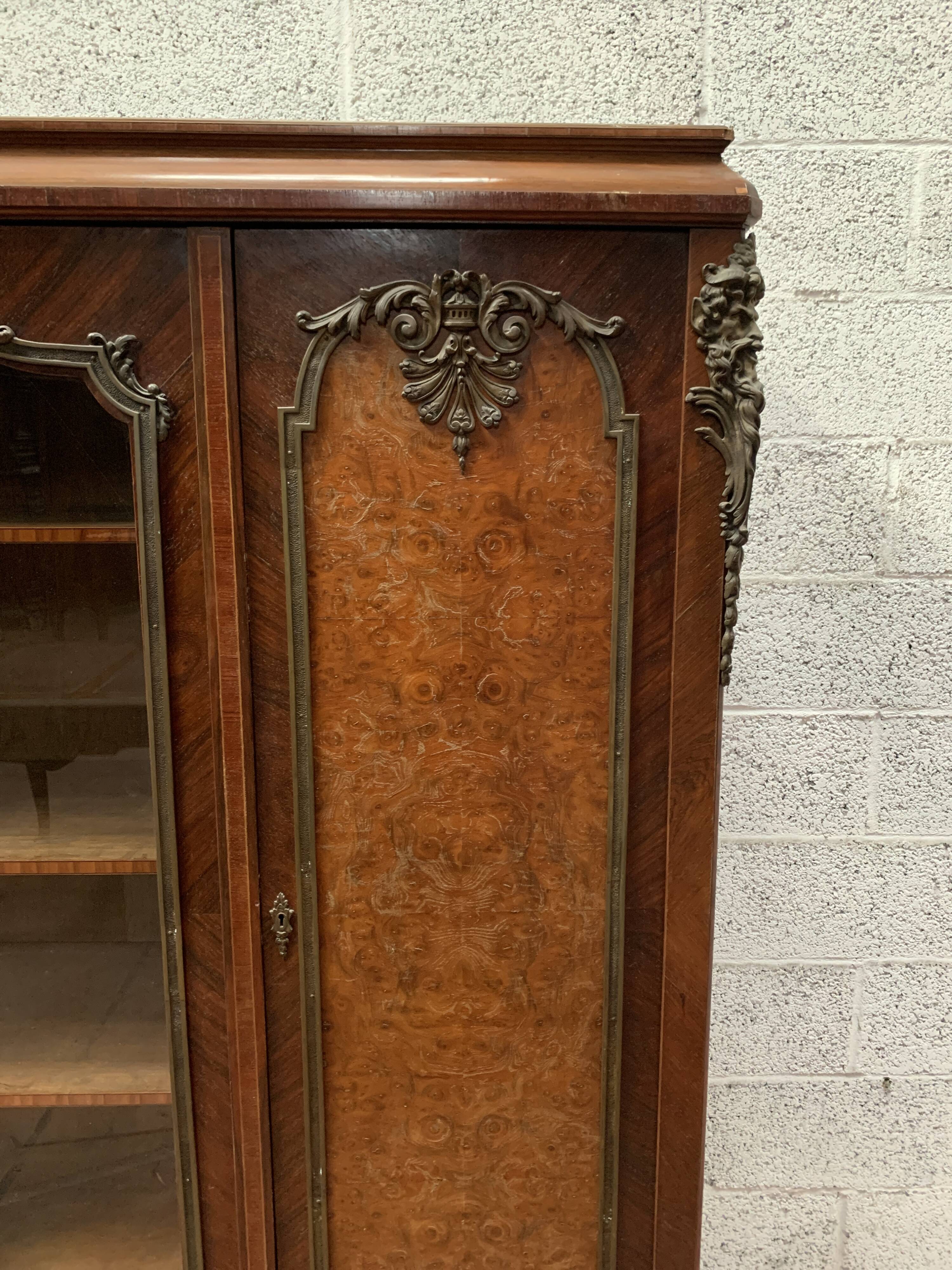 Louis XV style bookcase in mahogany and burr walnut, 20th century
