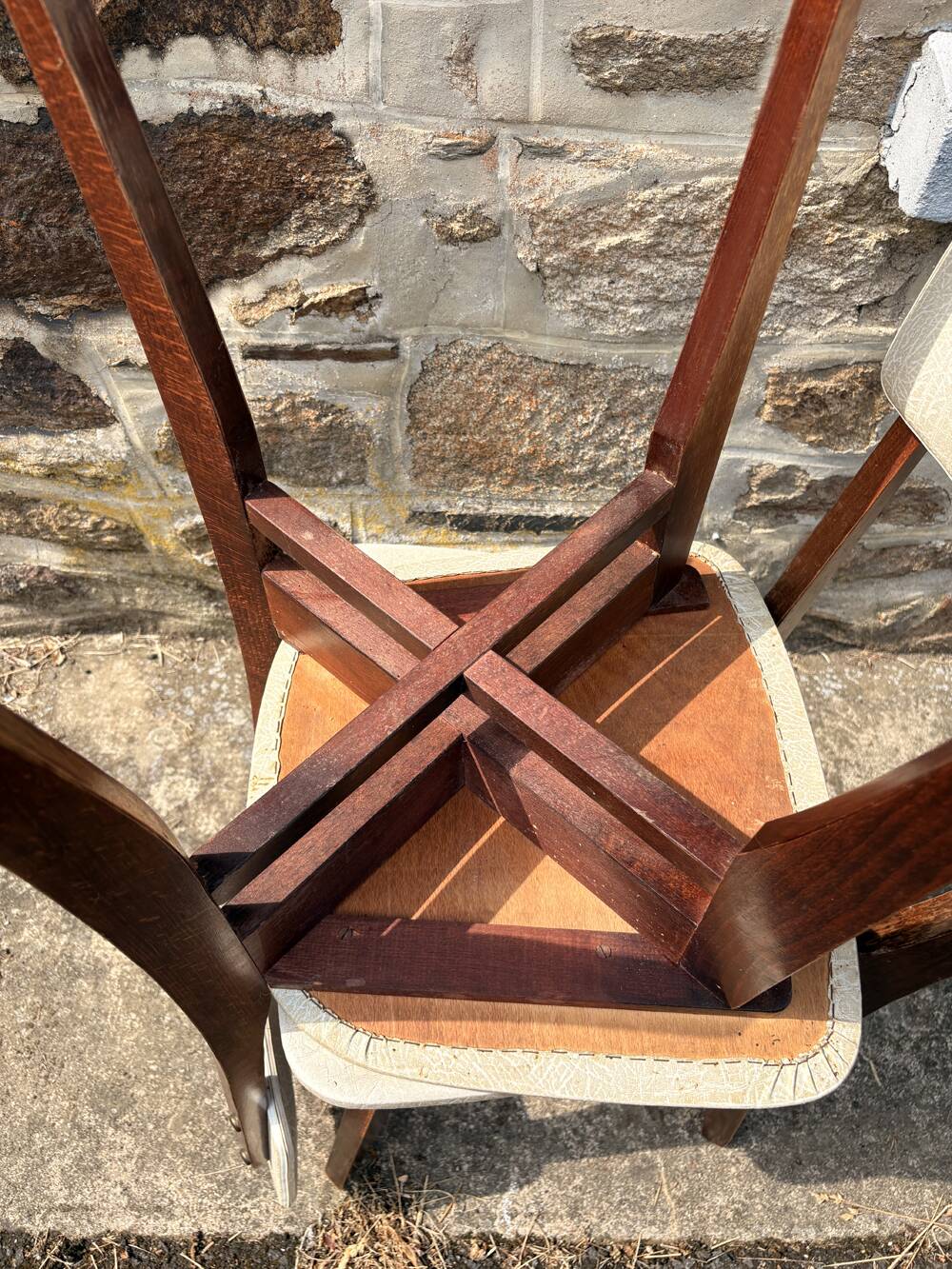 Pair of vintage chairs with upholstered backrest and seat, 1950s style.