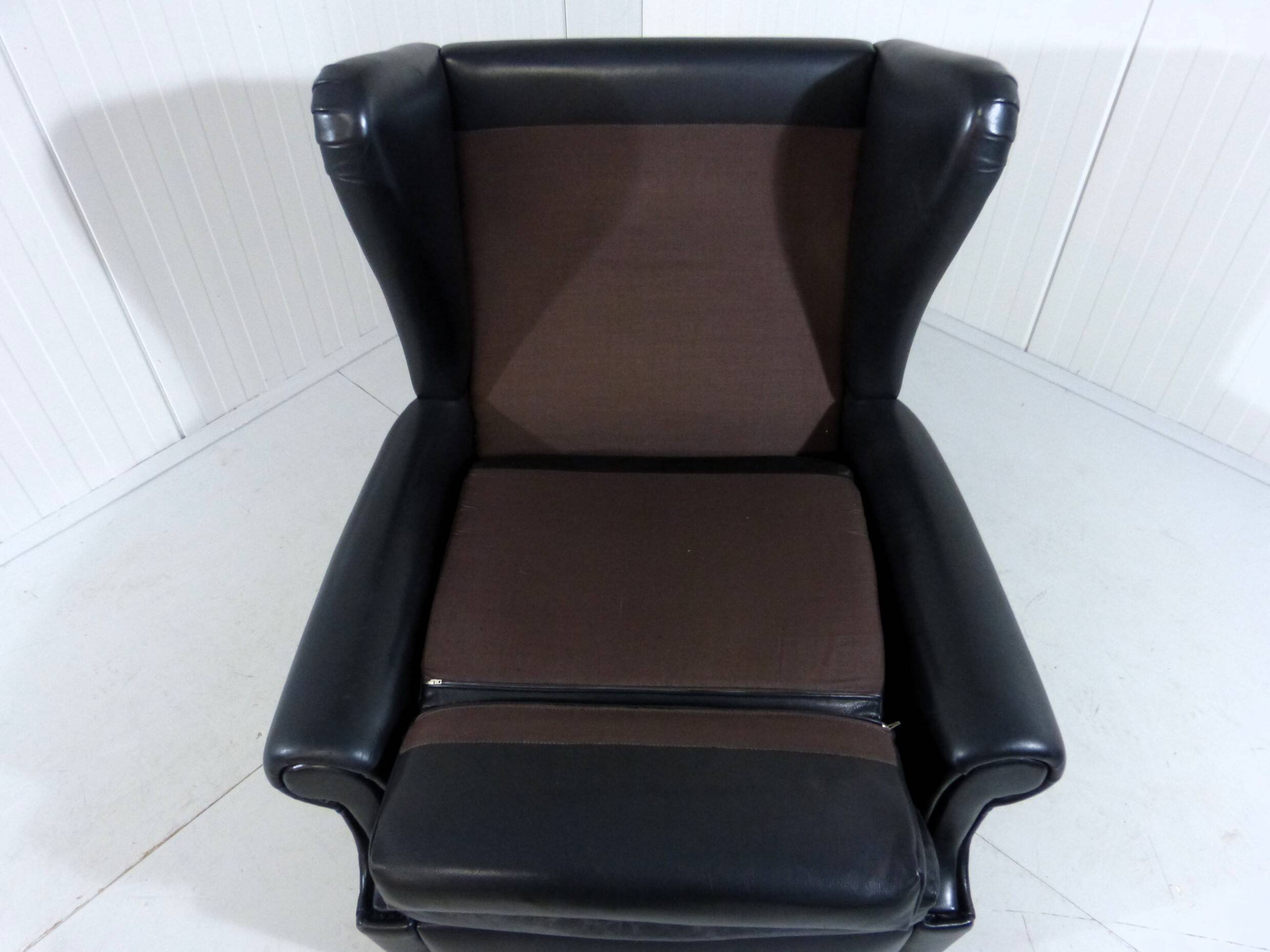 Black leather wingback chair on wheels 1960’s