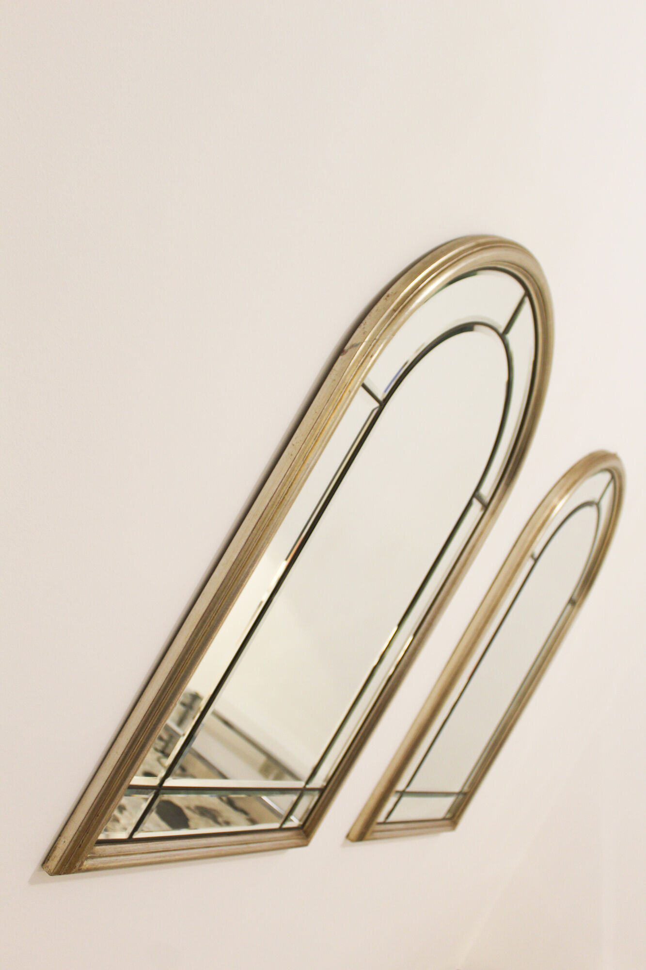 Pair of bevelled mirrors, brass edging frame in brushed wood years Italy 70's