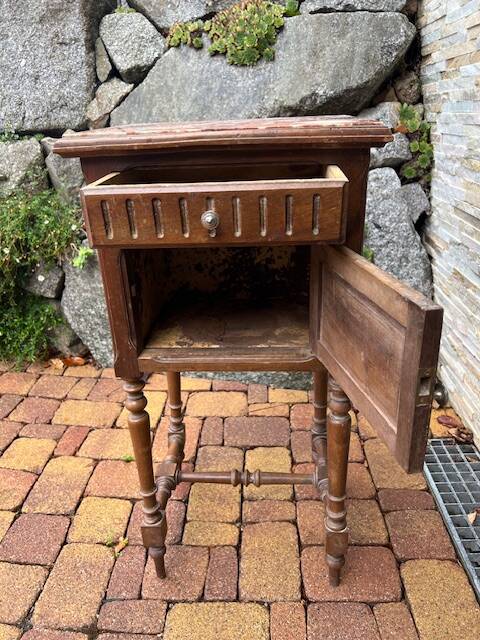 Wooden bedside table with marble top