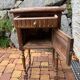 Wooden bedside table with marble top