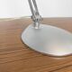 Grey LED architect lamp with spring arm and swivel base.