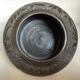 Black pottery catchall worked from Marginea, Romania.