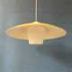Danish mid-century suspension with opaline glass shade and yellow metal cover.